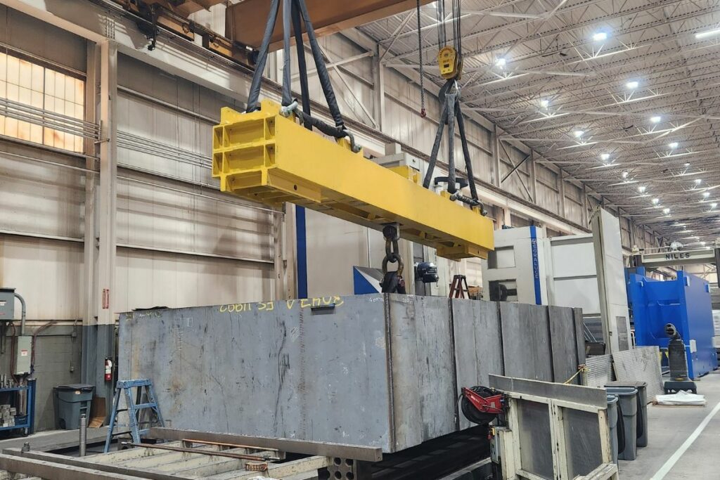 Overhead crane hauling large materials.