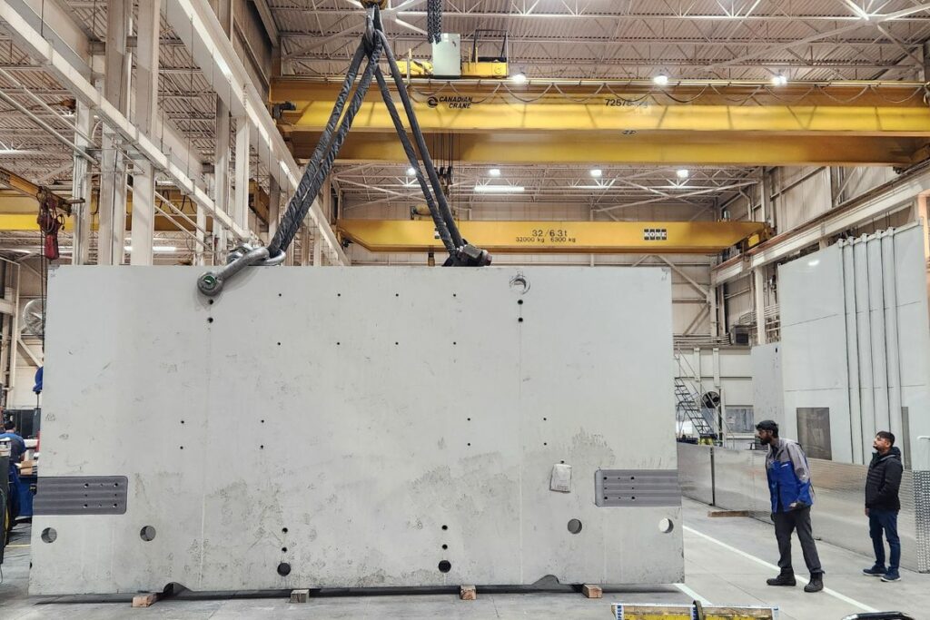 Overhead crane hauling large materials.