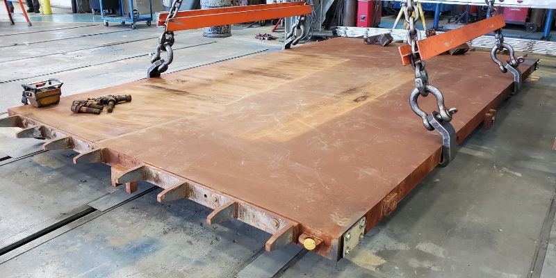 Materials from old platen arrive for refurbishment.